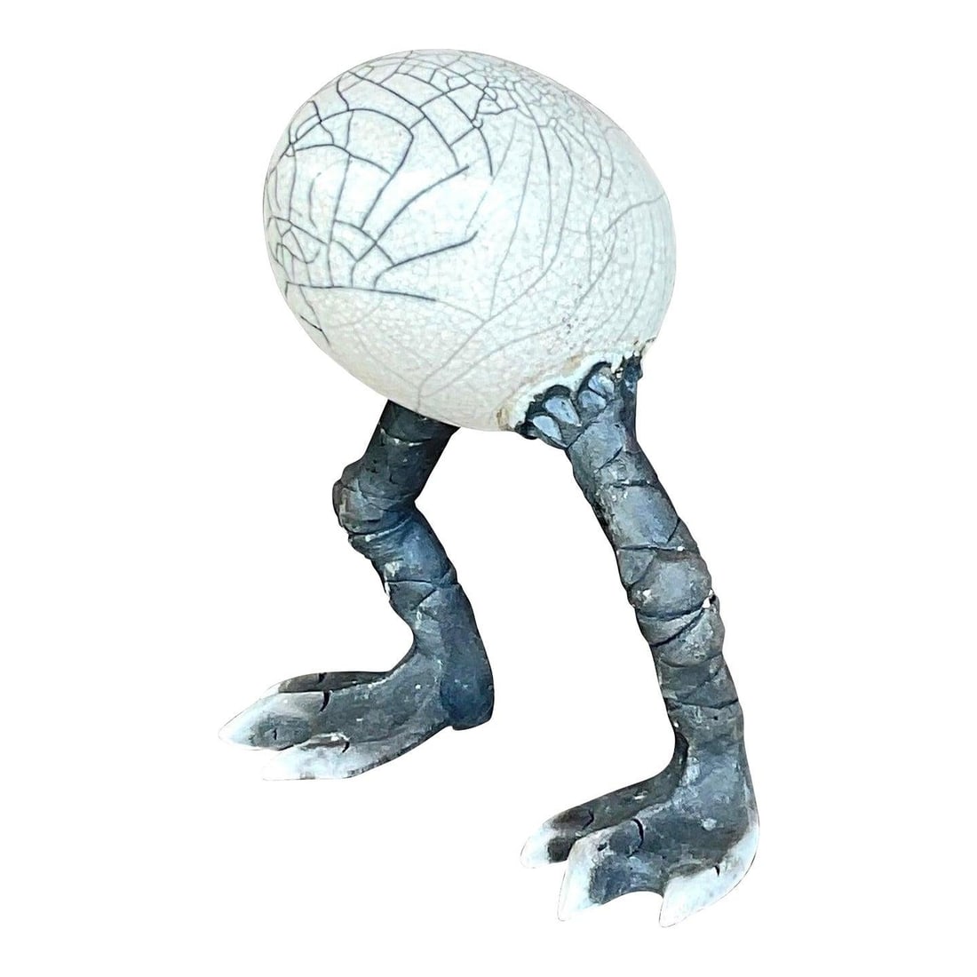Whimsical Vintage Boho Raku Fired Egg Sculpture with Bird-Like Legs: Whimsical Vintage Boho Raku Fired Egg Sculpture with Bird-Like Legs This Vintage Boho Raku Fired Egg Sculpture features a whimsical egg-shaped design, showcasing intricate crackled glaze effects chara