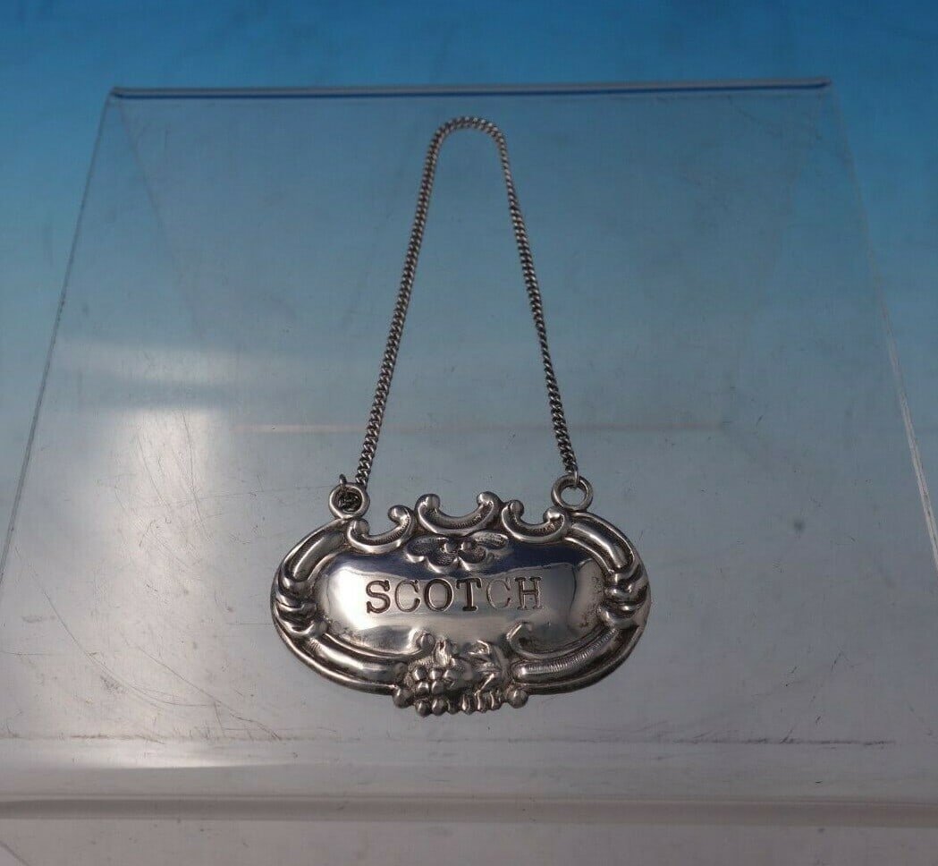 Wallace Lucerne Sterling Silver Liquor Label Scotch 2 x 1: Wallace Lucerne Sterling Silver Liquor Label Scotch 2 x 1 This exquisite Lucerne liquor label by Wallace is crafted from sterling silver, showcasing a classic design that epitomizes elegance. Measurin