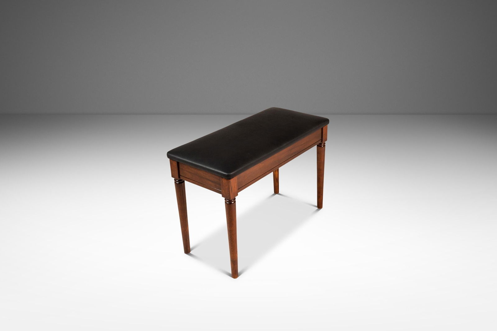 Mid-Century Modern Piano Bench by Manual Arts Walnut & Leather USA 1960s: Mid-Century Modern Piano Bench by Manual Arts Walnut & Leather USA 1960s Discover the elegance of the Mid-Century Modern Piano Bench crafted from solid black walnut and newly upholstered in genuine It