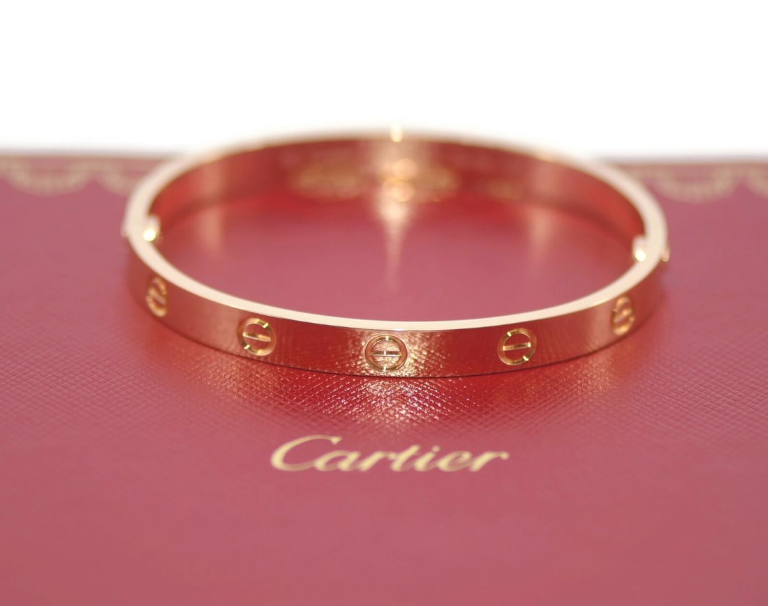 Cartier 18K Rose Gold Love Bangle Bracelet Size 17 Authentic: Cartier 18K Rose Gold Love Bangle Bracelet Size 17 Authentic Elevate your style with the iconic Cartier 18K Rose Gold Love Bracelet, a symbol of elegance and love. This stunning bangle is crafted from