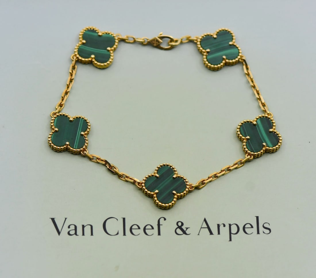 Van Cleef & Arpels Vintage Alhambra 18K Gold Malachite Charm Bracelet: Van Cleef & Arpels Vintage Alhambra 18K Gold Malachite Charm Bracelet Elevate your jewelry collection with this exquisite Van Cleef & Arpels Vintage Alhambra bracelet. Crafted from luxurious 18K yello