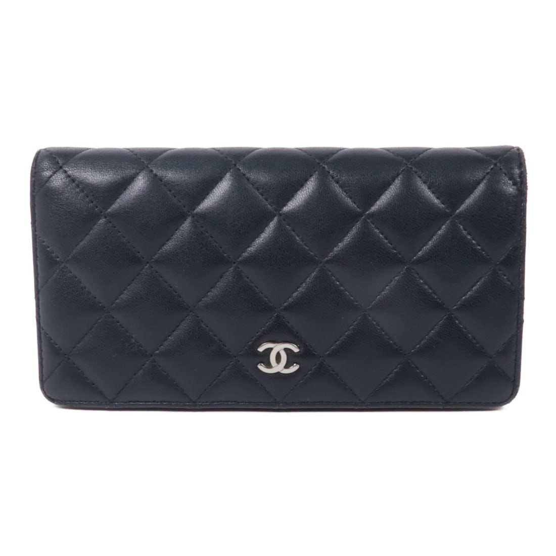 CHANEL CC Black Lambskin Leather Bifold Wallet SHW: CHANEL CC Black Lambskin Leather Bifold Wallet SHW This elegant CHANEL long wallet is crafted from luxurious black lambskin leather, showcasing the iconic CC logo in a stylish bifold design. It featur