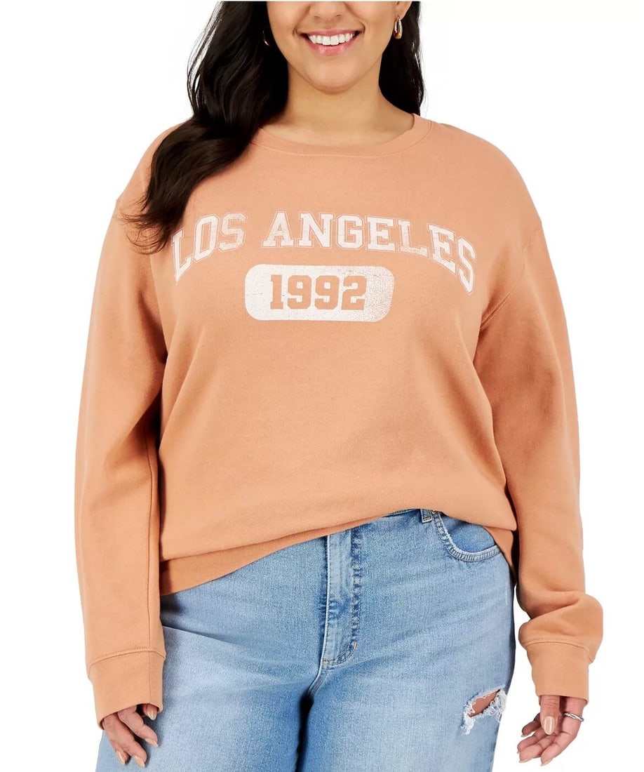 LOVE TRIBE 2X Orange Angel Graphic Pullover Sweatshirt: LOVE TRIBE 2X Orange Angel Graphic Pullover Sweatshirt Embrace comfort and style with the LOVE TRIBE Plus Size Los Angeles Graphic Sweatshirt in vibrant orange. This relaxed-fit pullover features a fu