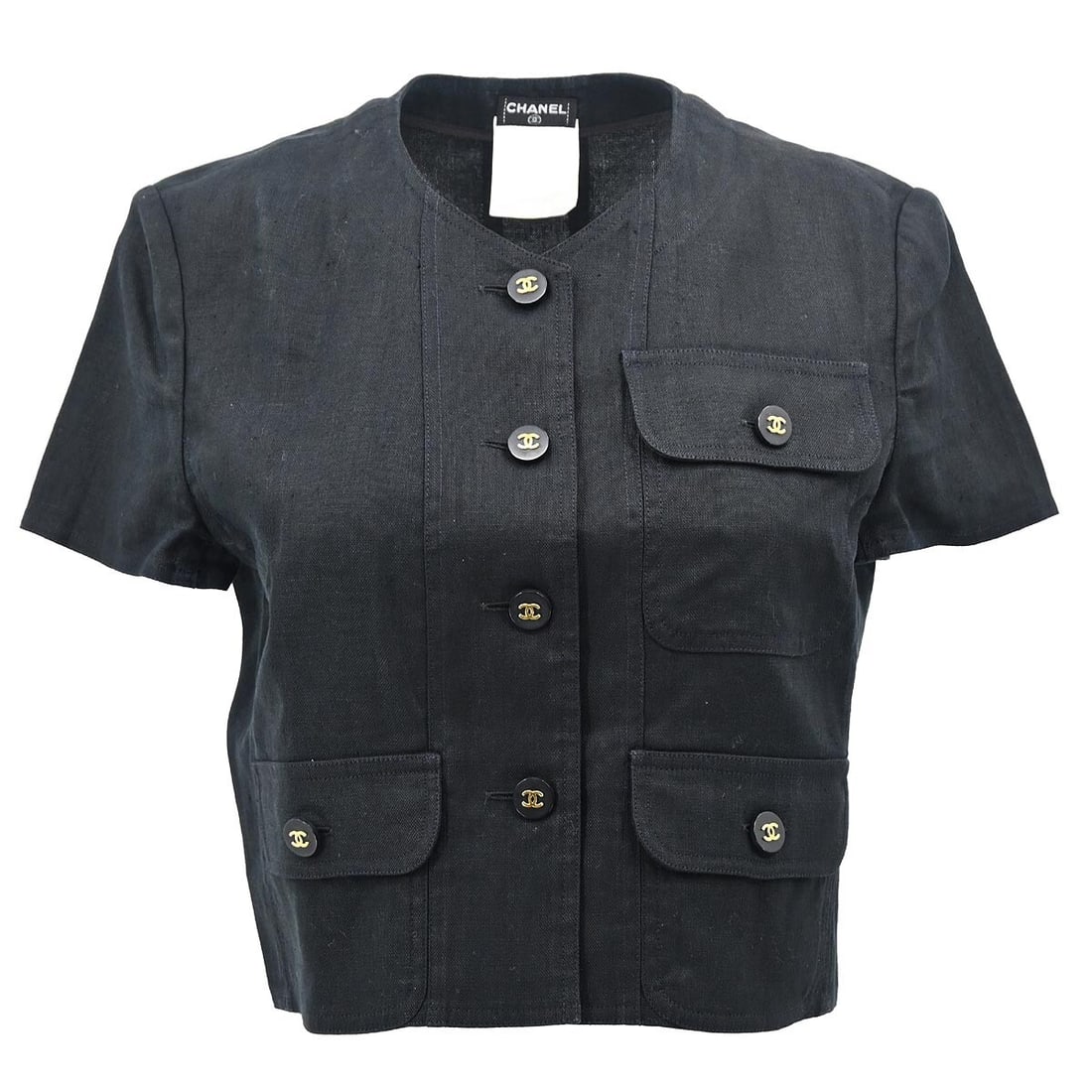 Chanel Vintage Black Linen Collarless Short Sleeve Jacket #40: Chanel Vintage Black Linen Collarless Short Sleeve Jacket #40 Embrace timeless elegance with this Chanel collarless jacket, expertly crafted from 100% linen in a classic black hue. Designed with short