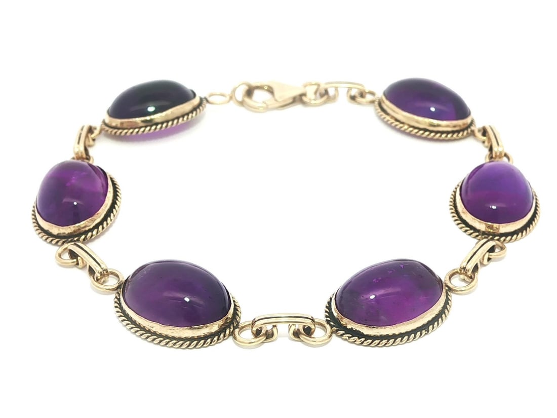 Carla 14k Yellow Gold Amethyst Cabochon Bracelet with Twisted Wire Design: Carla 14k Yellow Gold Amethyst Cabochon Bracelet with Twisted Wire Design This exquisite bracelet features six natural genuine amethysts, each an oval cabochon cut and bezel set, showcasing a deep pur