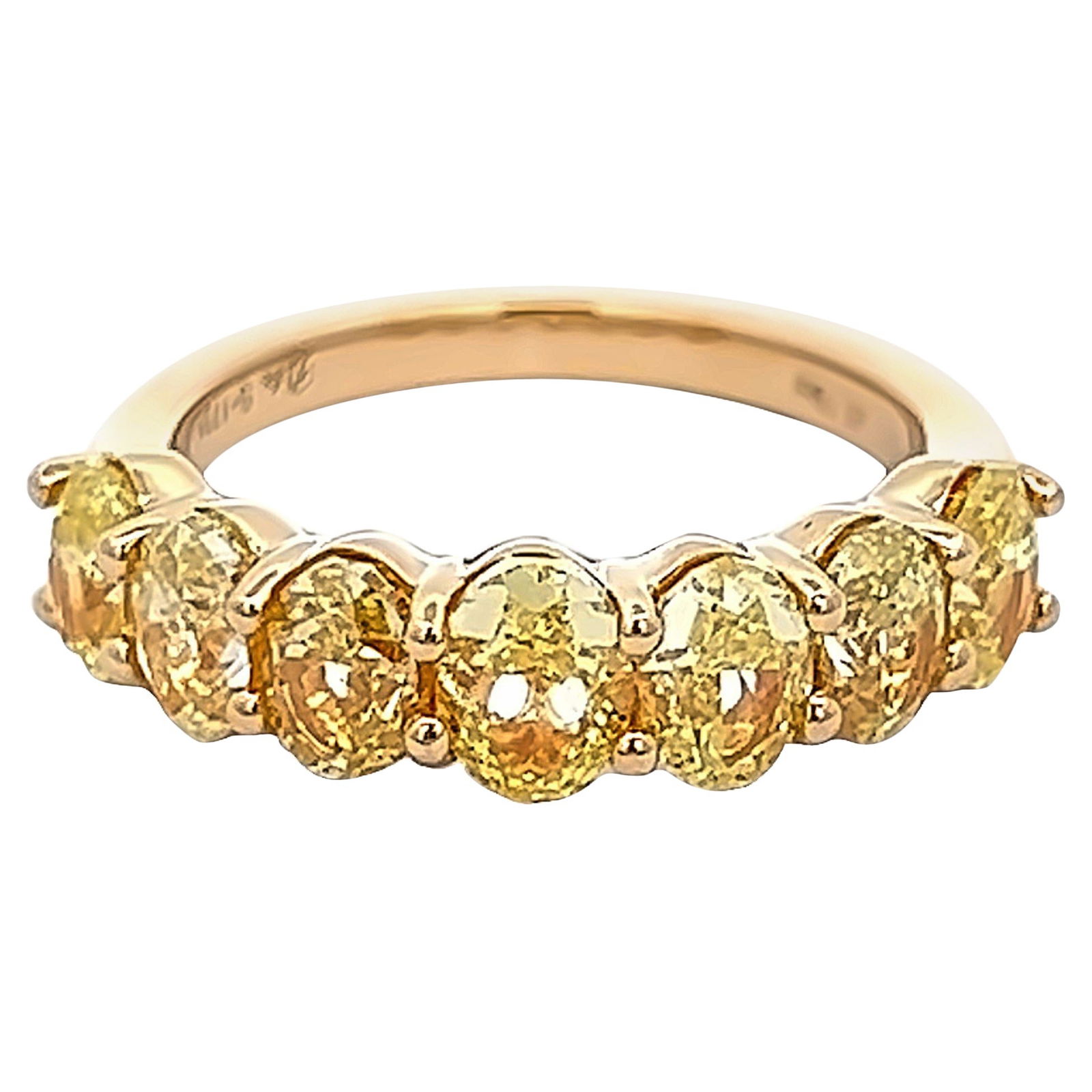 3.19ct Fancy Intense Yellow Diamond Half Eternity Ring in 18k Gold: 3.19ct Fancy Intense Yellow Diamond Half Eternity Ring in 18k Gold This exquisite half eternity band features a stunning array of seven oval diamonds totaling 3.19 carats. The diamonds exhibit an appr