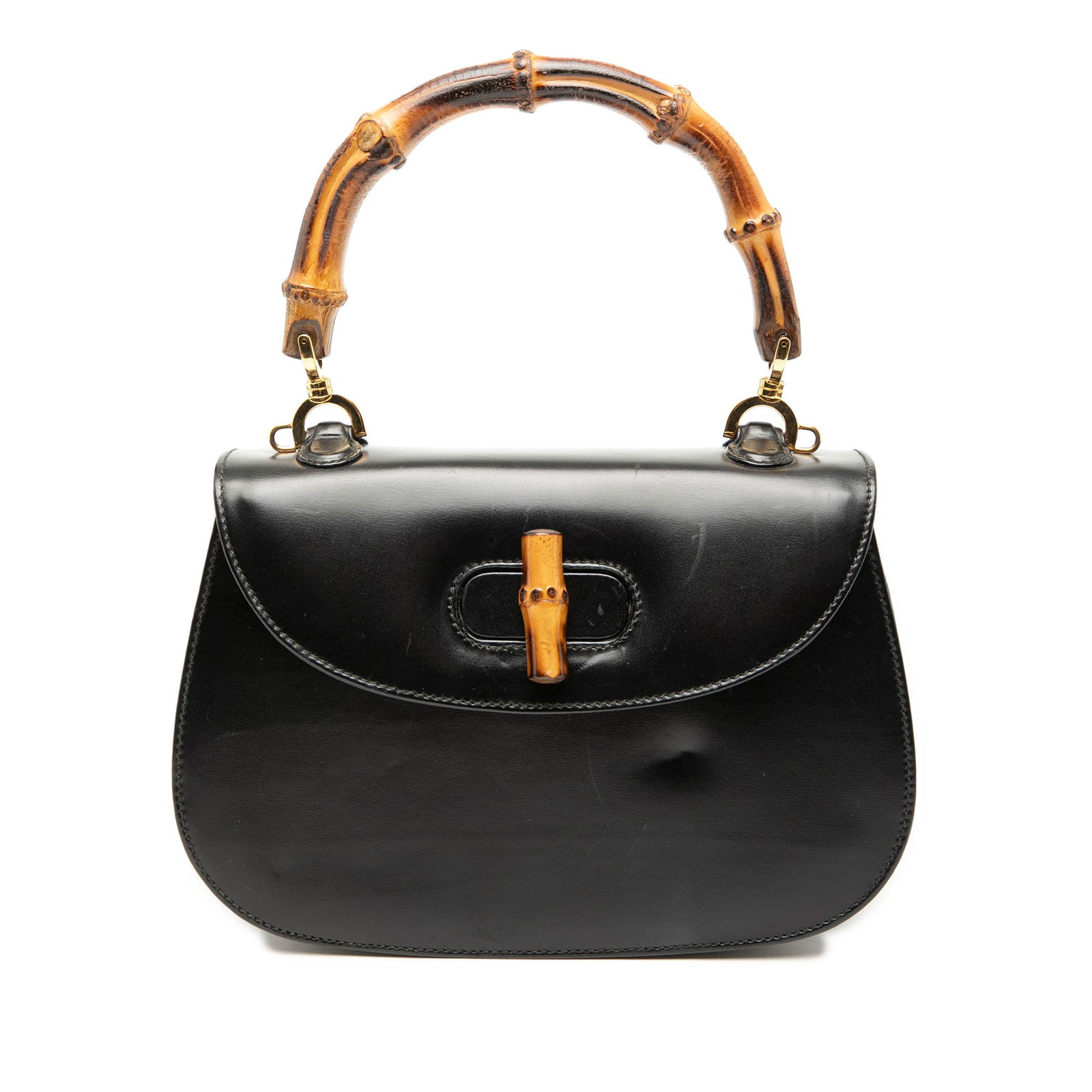 Gucci Calfskin Bamboo Night Satchel Black Leather Italy: Gucci Calfskin Bamboo Night Satchel Black Leather Italy This Gucci Calfskin Bamboo Night satchel showcases a sophisticated leather construction with a distinctive bamboo top handle. It features a fron