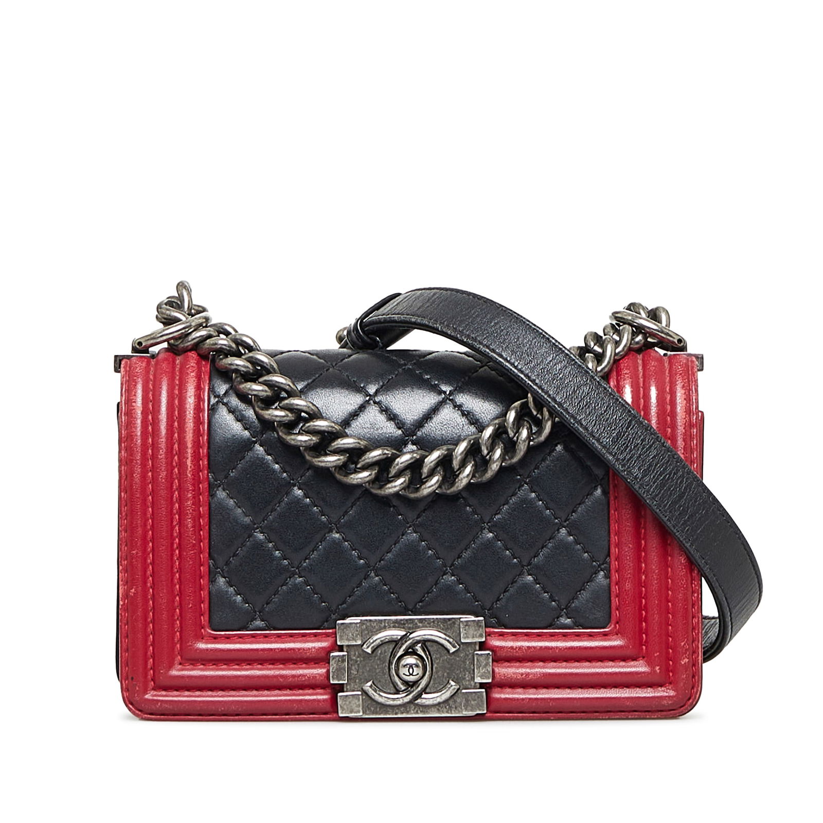 Chanel Small Bicolor Boy Flap Bag Black Leather CC Closure: Chanel Small Bicolor Boy Flap Bag Black Leather CC Closure This Chanel Small Bicolor Boy flap bag showcases a sophisticated design featuring a quilted leather body and curb chain straps. It is equippe