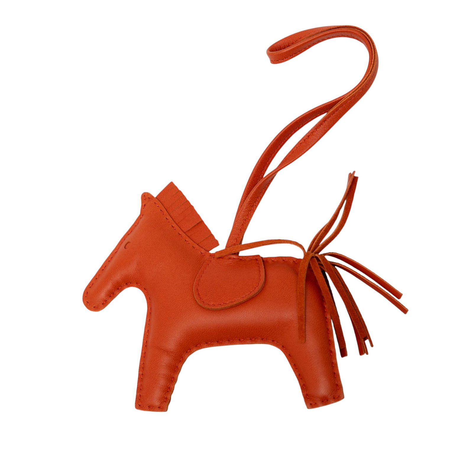 Hermes Milo Lambskin Grigri Rodeo Bag Charm Orange: Hermes Milo Lambskin Grigri Rodeo Bag Charm Orange Introducing the Hermes Milo Lambskin Grigri Rodeo Bag Charm MM, a stylish accessory crafted from luxurious lambskin leather. This charming bag charm