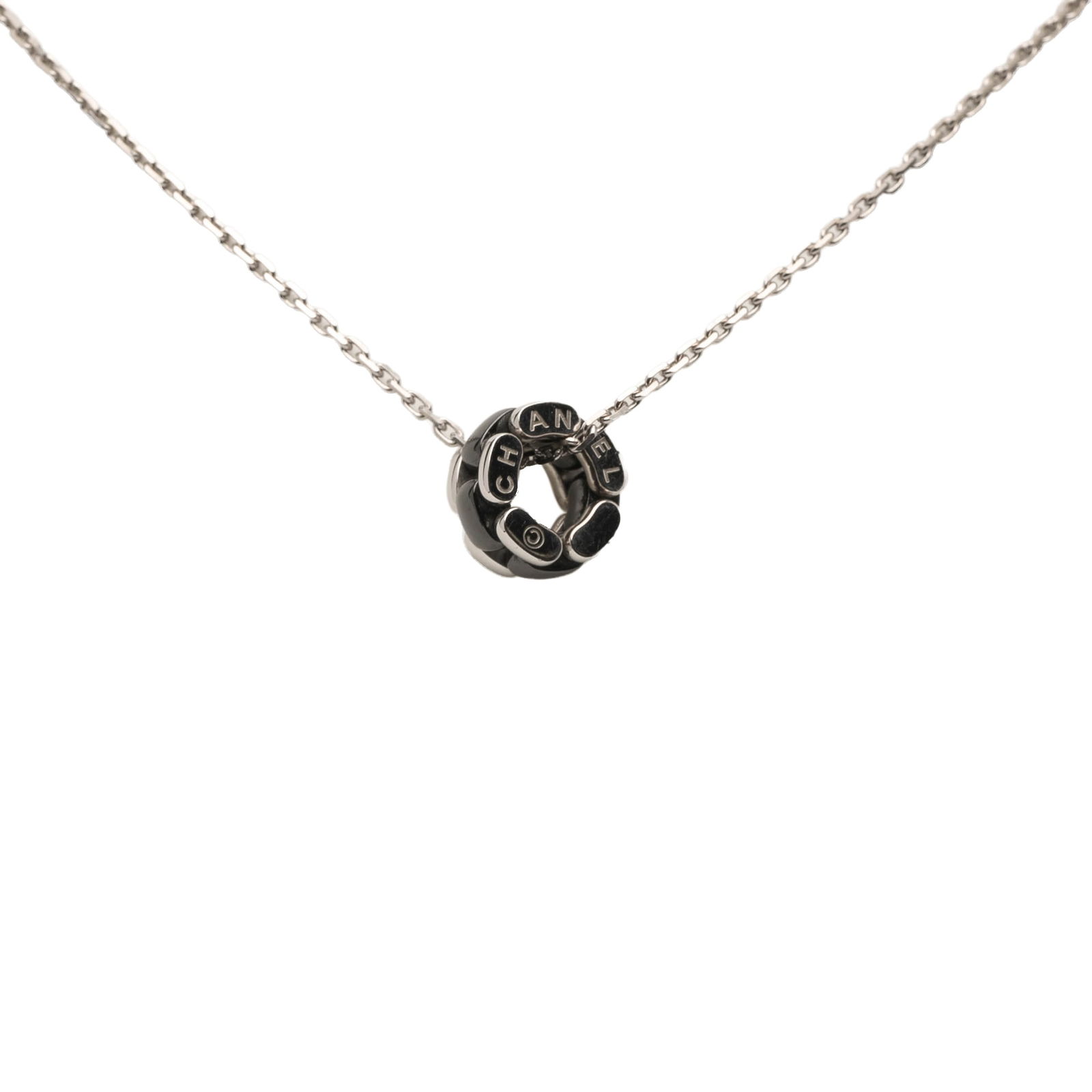 Chanel 18K White Gold and Ceramic Ultra Necklace: Chanel 18K White Gold and Ceramic Ultra Necklace This stunning necklace showcases a sophisticated design with an 18K white gold body and an elegant pendant crafted from 18K white gold and ceramic. The