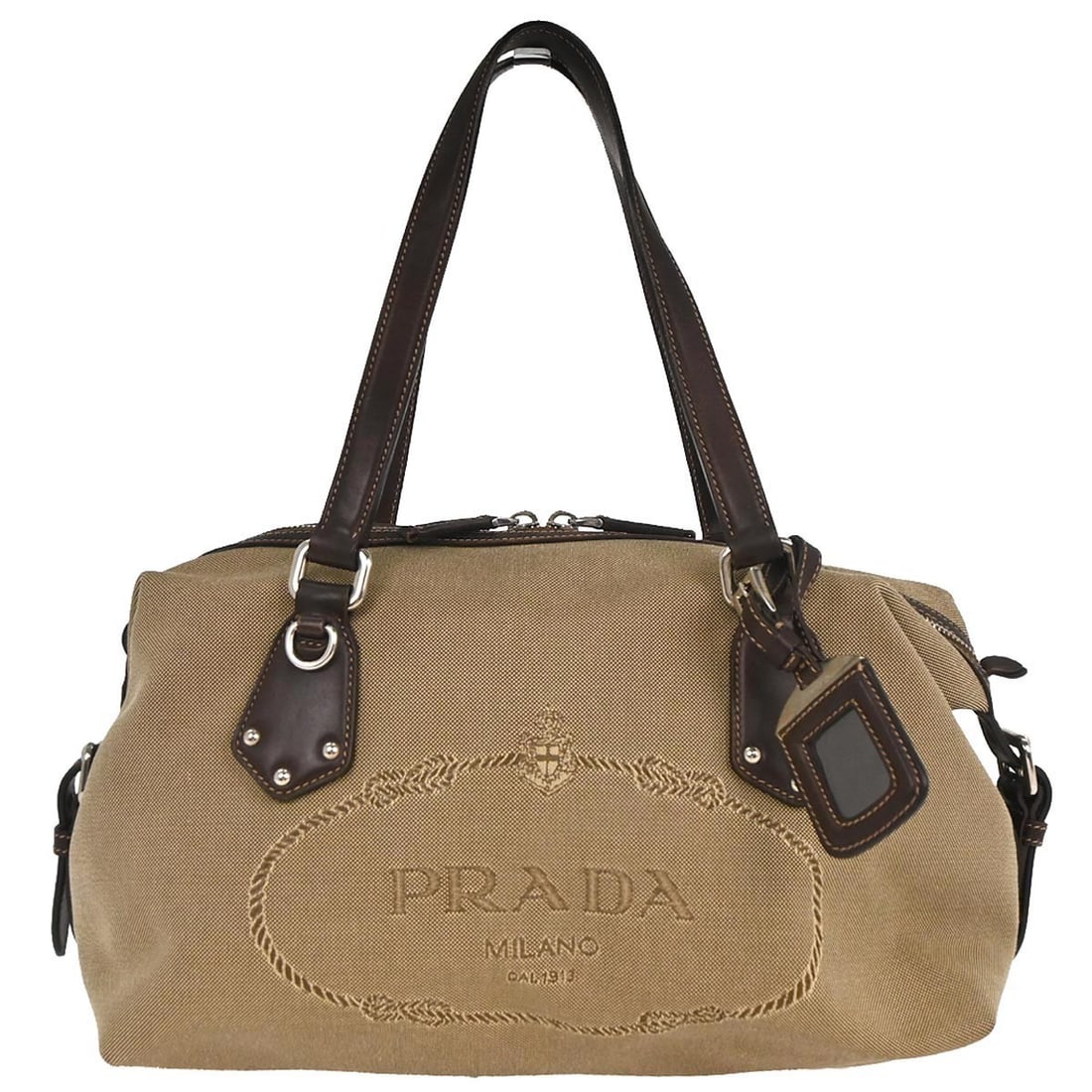 Prada Brown Canvas Top Handle Handbag Made in Italy: Prada Brown Canvas Top Handle Handbag Made in Italy This Prada Brown Canvas Handbag is a stylish and versatile accessory perfect for casual occasions. Crafted from high-quality canvas leather, it feat