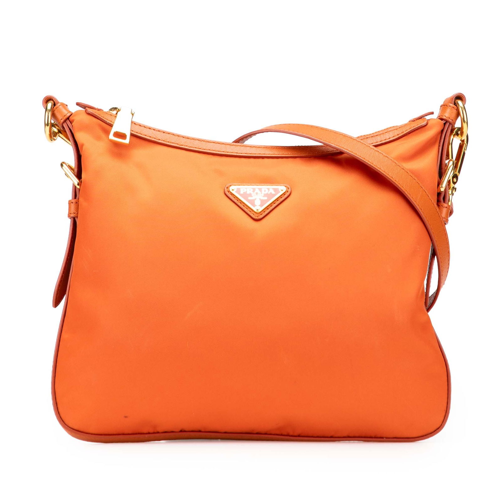 Prada Saffiano Trimmed Tessuto Orange Crossbody Bag: Prada Saffiano Trimmed Tessuto Orange Crossbody Bag Introducing the Prada Saffiano Trimmed Tessuto Zip Top Crossbody, a stylish and functional accessory designed for versatility. This crossbody bag is