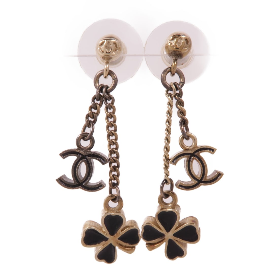 CHANEL Gold Black CC Logo Pierced Earrings: CHANEL Gold Black CC Logo Pierced Earrings Elevate your accessory collection with these exquisite CHANEL CC Earrings. Crafted in a striking gold tone, these pierced earrings embody the elegance and so