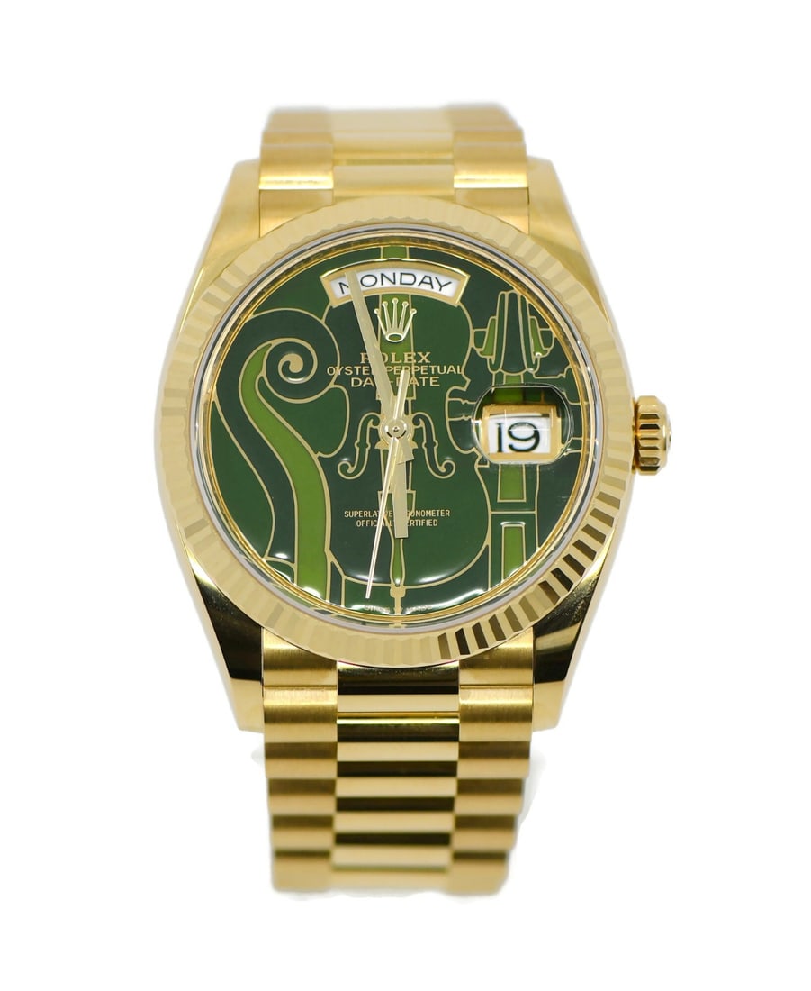 Rolex Day-Date 18K Yellow Gold Watch Green Dial Ref 128238: Rolex Day-Date 18K Yellow Gold Watch Green Dial Ref 128238 The Rolex Day-Date Vienna Philharmonic is a stunning wristwatch crafted in 18K yellow gold. Featuring a mechanical (automatic) movement, this
