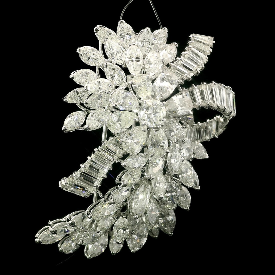 Platinum 16.5ct Floral Spray Brooch with Diamonds: Platinum 16.5ct Floral Spray Brooch with Diamonds This exquisite floral spray brooch features a stunning arrangement of 83 natural genuine diamonds, including round, marquise, pear, and baguette cuts.