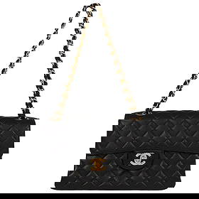 Chanel Black Caviar Leather Double Sided Classic Flap Handbag: Chanel Black Caviar Leather Double Sided Classic Flap Handbag Introducing the Chanel Black Calfskin Double Sided Flap Handbag, a luxurious accessory perfect for casual occasions. This medium-sized bag