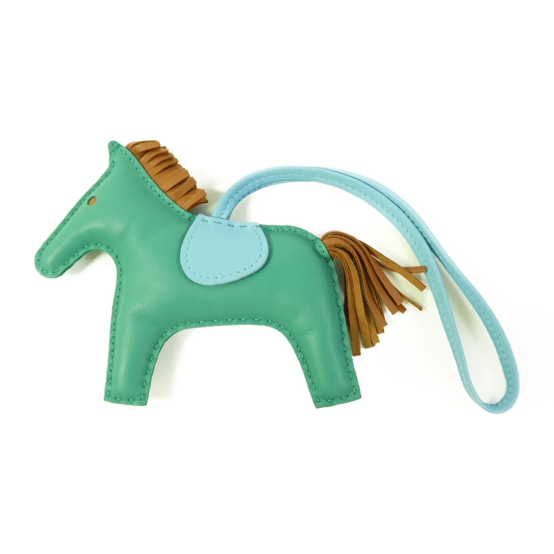 HERMES Rodeo MM Charm Green Blue Brown Lambskin Leather: HERMES Rodeo MM Charm Green Blue Brown Lambskin Leather Add a touch of elegance to your accessories with this HERMES Rodeo MM Charm. Expertly crafted from soft lambskin in a stunning green hue, this c