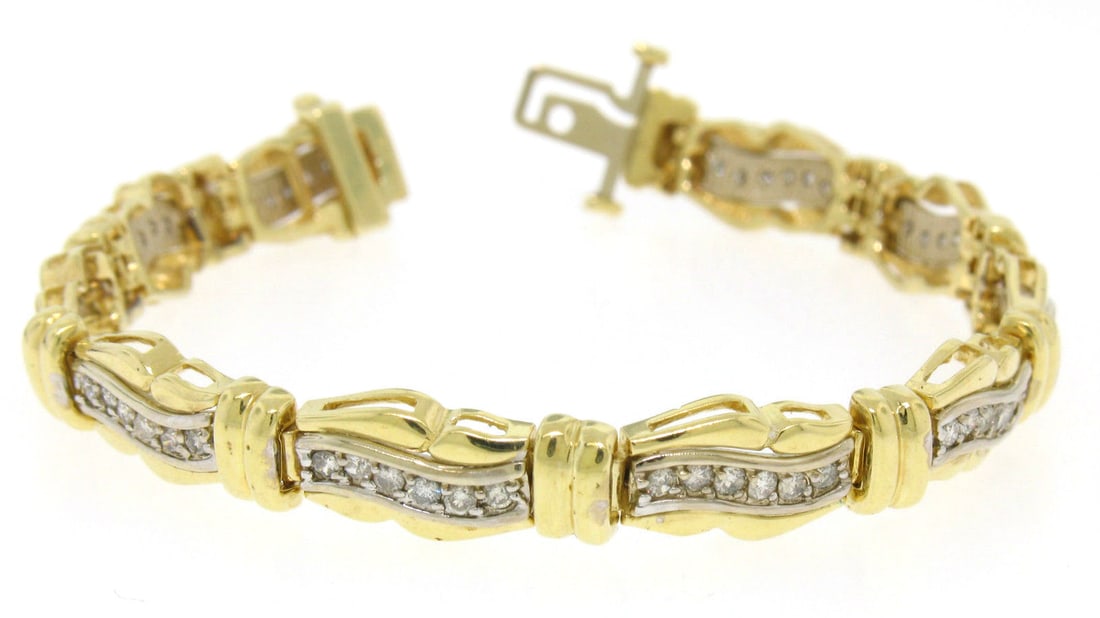 14K Multi-Tone Gold 1.50ctw Round Pave Diamond Wavy Bracelet: 14K Multi-Tone Gold 1.50ctw Round Pave Diamond Wavy Bracelet This stunning bracelet features a unique wavy design crafted from solid 14K yellow and white gold. It showcases 60 natural, genuine round b