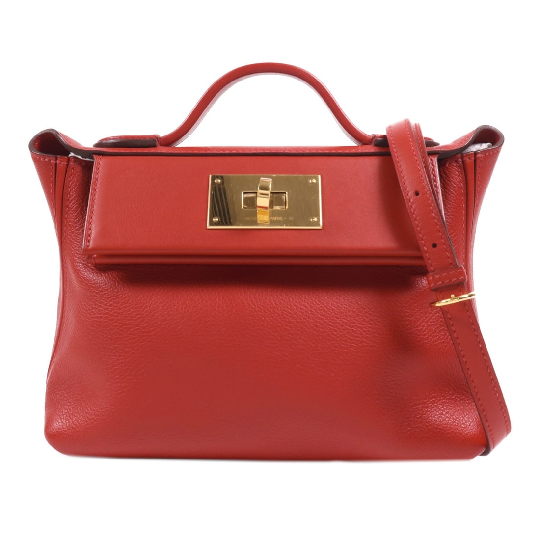 HERMES 24/24 Mini 2 Way Shoulder Bag Evercolor Leather Red: HERMES 24/24 Mini 2 Way Shoulder Bag Evercolor Leather Red This exquisite HERMES 24/24 Mini 2 Way Shoulder Bag is crafted from premium Evercolor leather, showcasing a stunning Rouge Piment hue. Design
