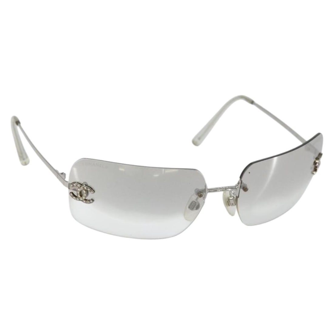 CHANEL Silver Metal Sunglasses with Authenticity AM9928V: CHANEL Silver Metal Sunglasses with Authenticity AM9928V Elevate your style with these authentic CHANEL sunglasses, crafted in Italy. Featuring a sleek silver metal frame, these sunglasses offer a mod
