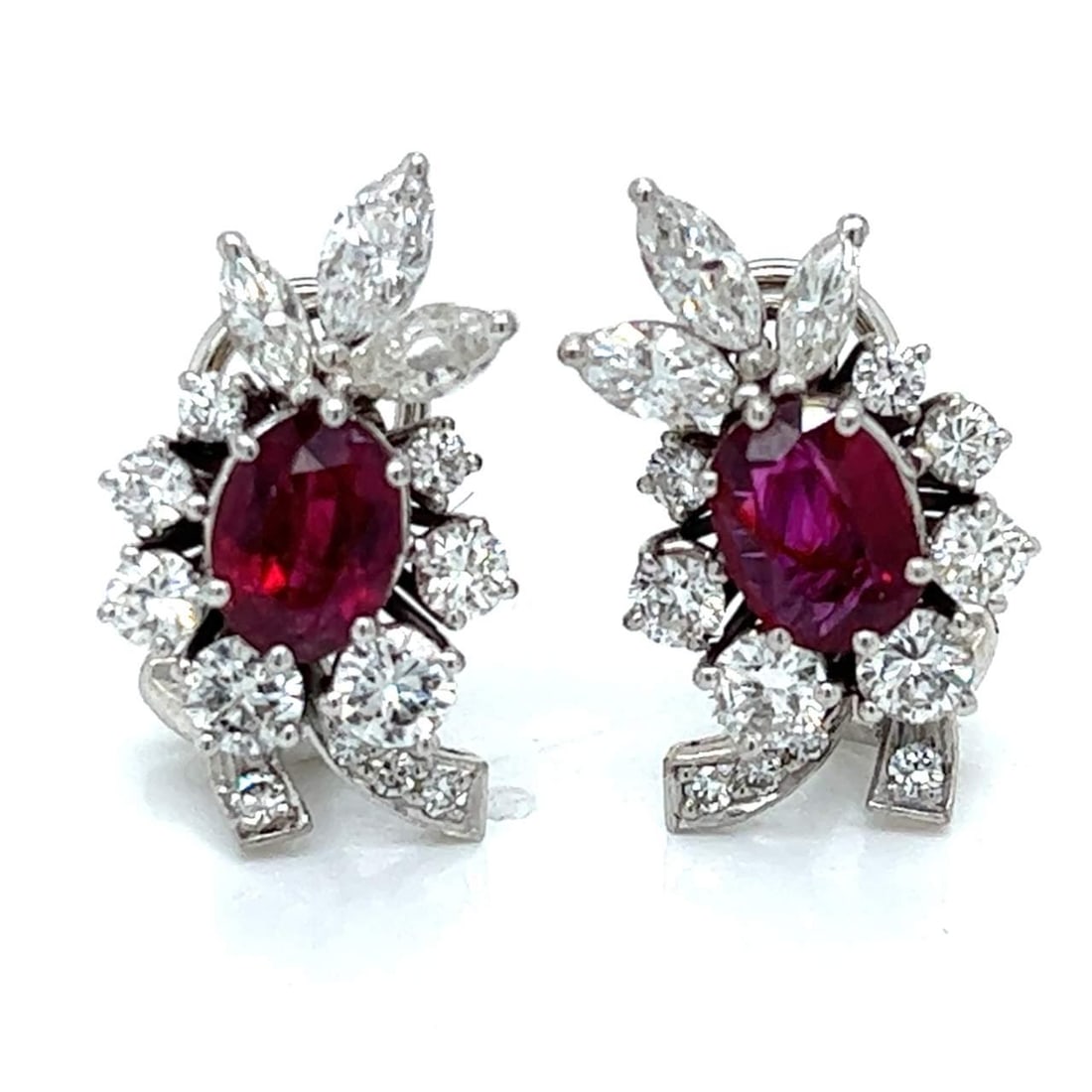 Elegant 18K White Gold Ruby Diamond Earrings 2.20 Ct Rubies 2.50 Ct Diamonds: Elegant 18K White Gold Ruby Diamond Earrings 2.20 Ct Rubies 2.50 Ct Diamonds Elevate your elegance with these stunning 18K White Gold Ruby & Diamond Earrings. These exquisite earrings feature two vibr