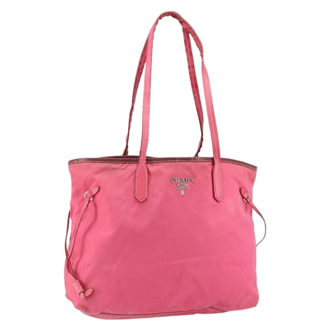 PRADA Pink Silver Nylon Tote Bag Auth Italy: PRADA Pink Silver Nylon Tote Bag Auth Italy This authentic PRADA Tote Bag showcases a chic blend of pink and silver nylon, making it a stylish accessory for any occasion. Measuring approximately 13.0