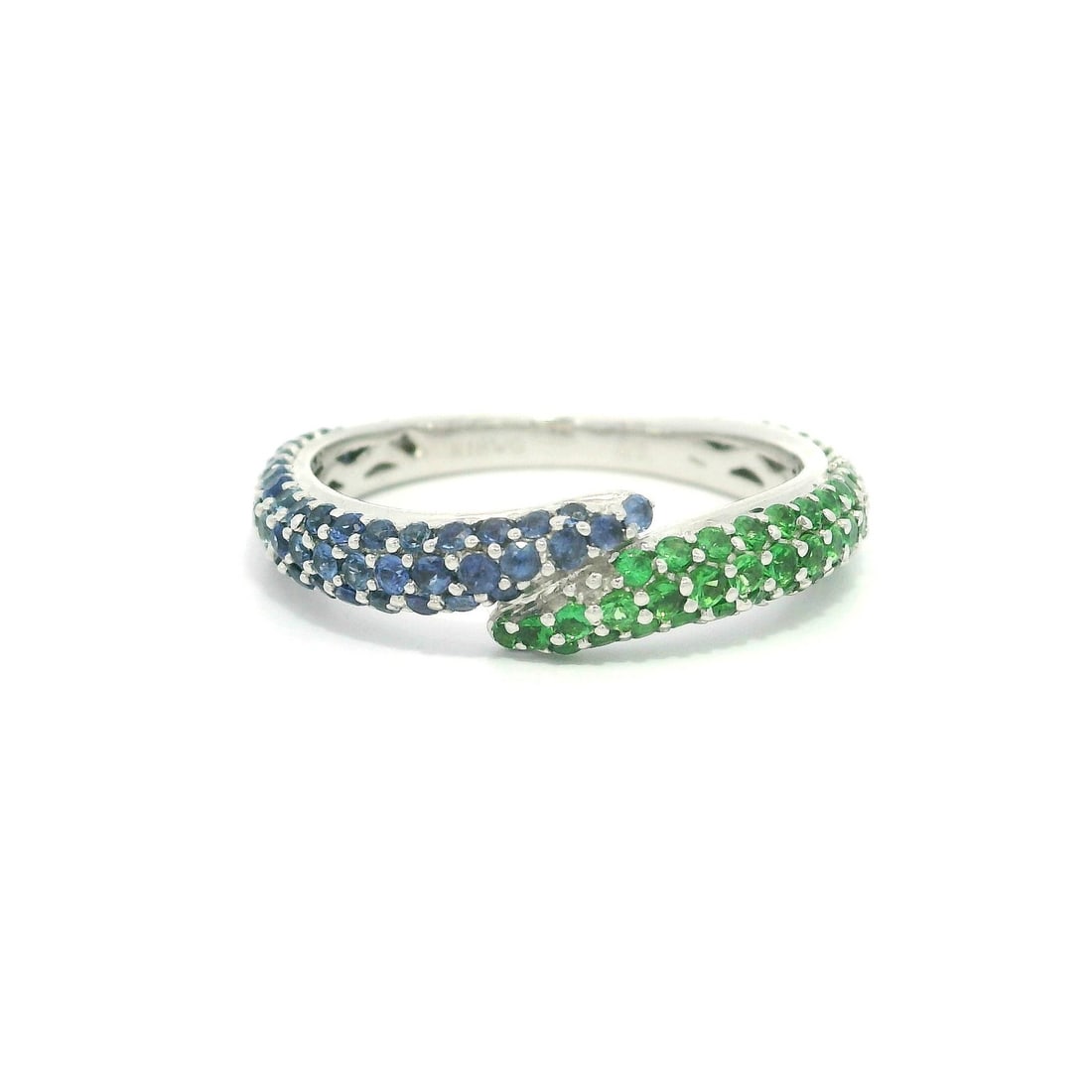 18k White Gold Micro Pave Sapphire Tsavorite Bypass Band Ring 1.03ctw: 18k White Gold Micro Pave Sapphire Tsavorite Bypass Band Ring 1.03ctw This stunning bypass band ring features a harmonious blend of natural genuine sapphires and tsavorites, elegantly set in solid 18k