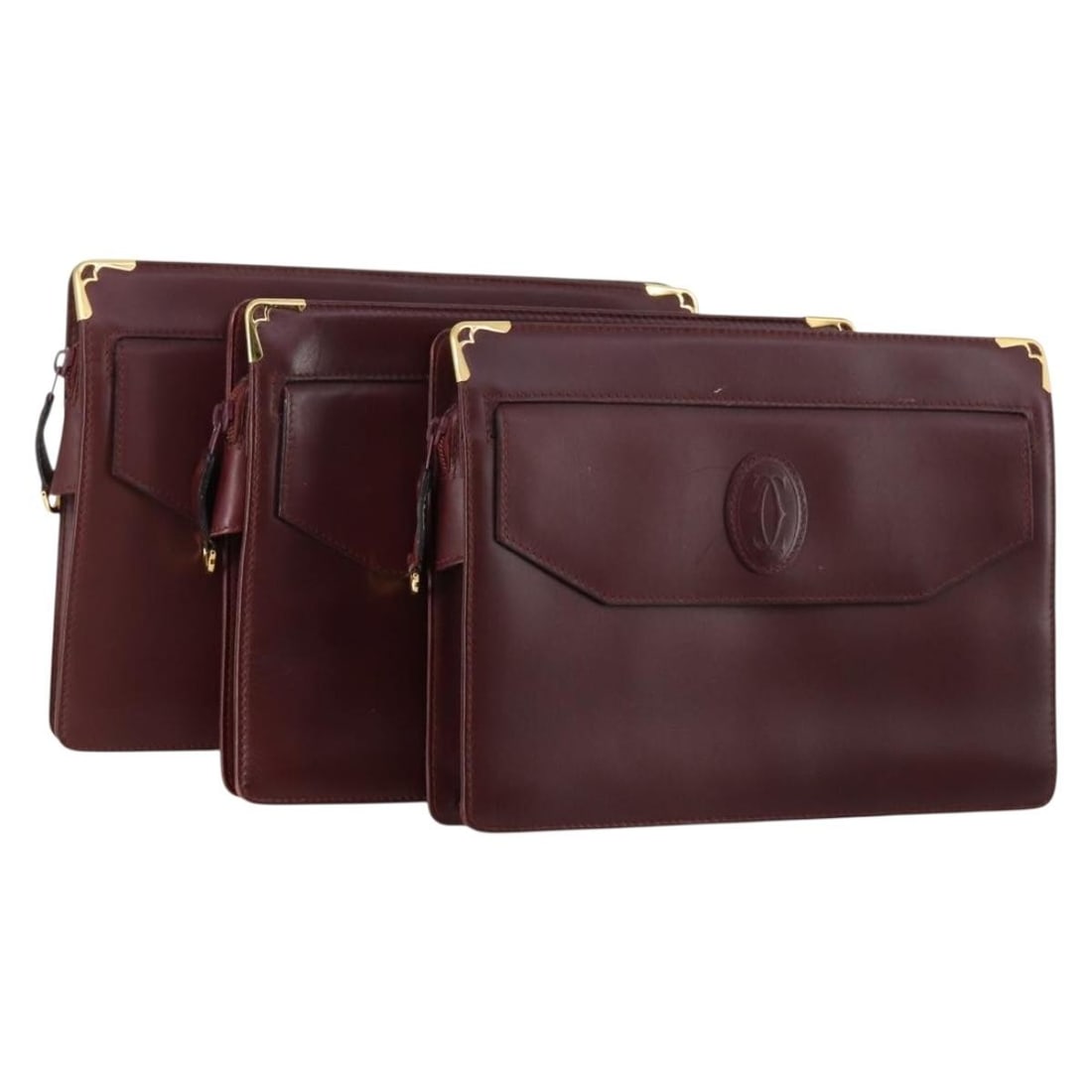 CARTIER Must Line Bordeaux Gold Leather Clutch Bag Set of 3: CARTIER Must Line Bordeaux Gold Leather Clutch Bag Set of 3 This exquisite CARTIER Must Line Clutch Bag set features a stylish design in a rich Bordeaux and Gold color combination. Crafted from high-q