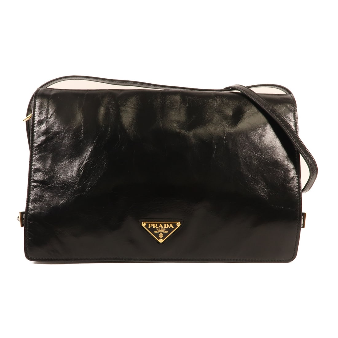 PRADA Black Calfskin Leather Shoulder Bag GHW Italy: PRADA Black Calfskin Leather Shoulder Bag GHW Italy This PRADA shoulder bag is crafted from high-quality calfskin leather in a classic black color. Designed for both style and functionality, it featur