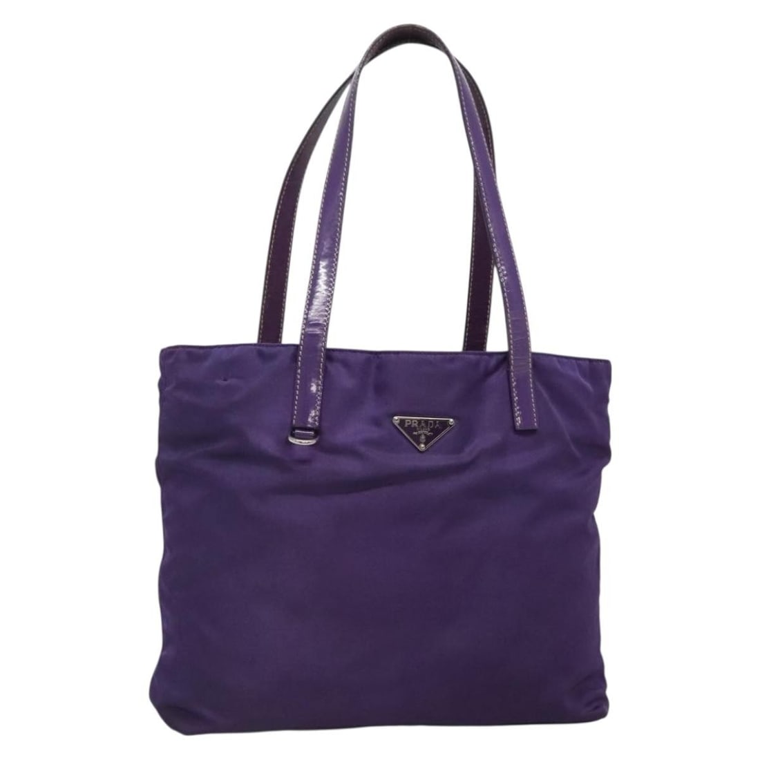 PRADA Purple Silver Nylon Tote Bag Made in Italy BA4659: PRADA Purple Silver Nylon Tote Bag Made in Italy BA4659 This authentic PRADA tote bag is crafted from durable nylon in a striking purple and silver color combination. Measuring approximately 10.6 inch