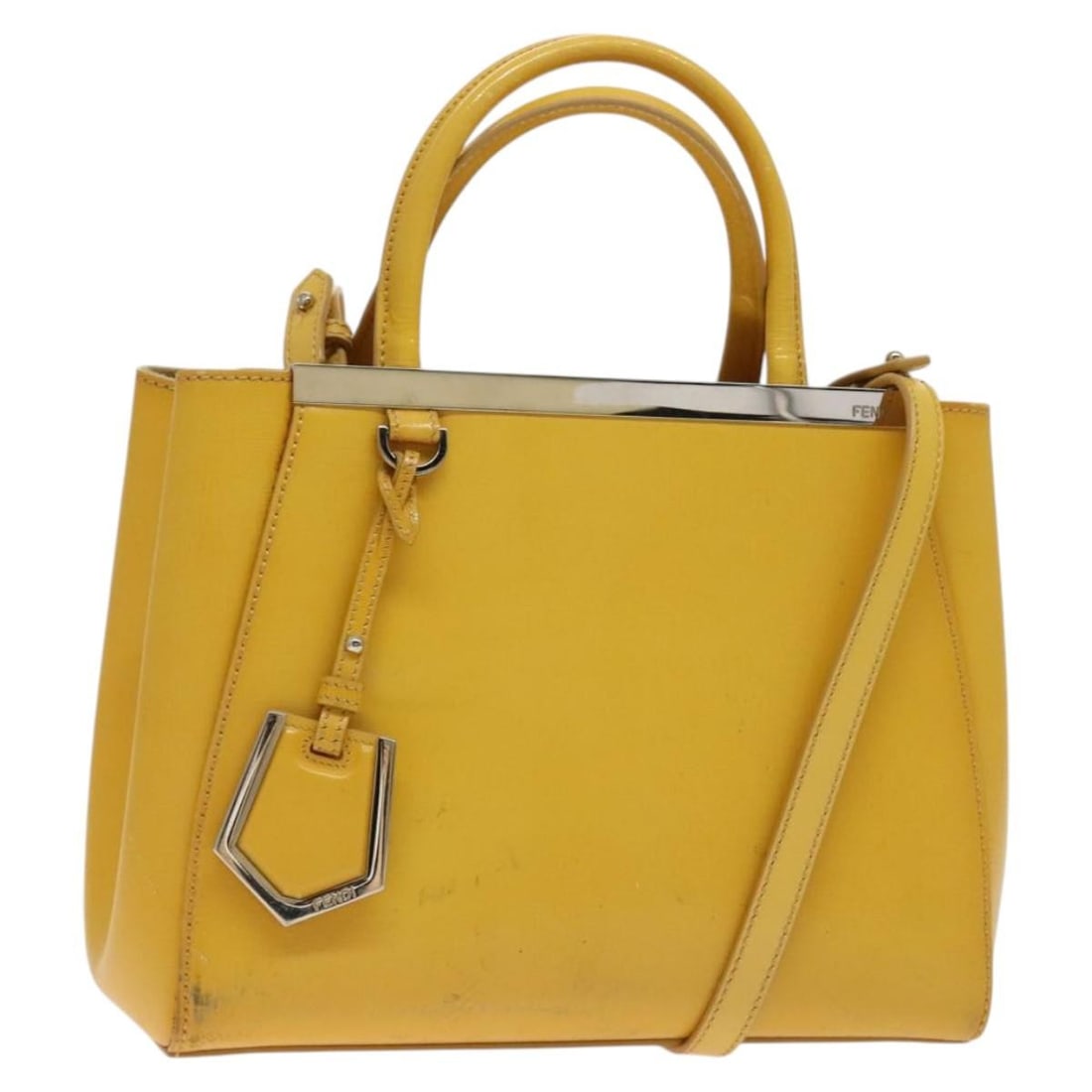 Authentic FENDI Yellow Silver Leather Hand Bag Made in Italy: Authentic FENDI Yellow Silver Leather Hand Bag Made in Italy This FENDI handbag is crafted from premium leather in a striking yellow and silver color combination. Designed for both style and functiona