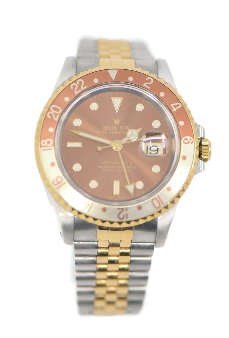 Rolex GMT-Master II Root Beer 18K Stainless Steel Watch 16713 Authentic: Rolex GMT-Master II Root Beer 18K Stainless Steel Watch 16713 Authentic Discover the exquisite craftsmanship of the Rolex GMT-Master II Root Beer watch, a perfect blend of luxury and functionality. Th