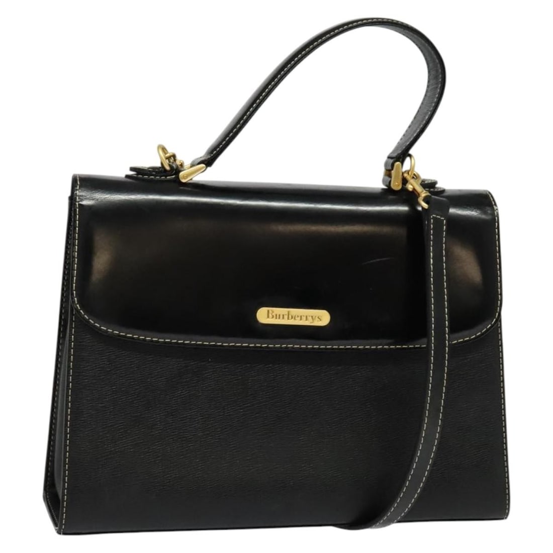 Burberrys Black Gold Leather 2-way Hand Bag Auth: Burberrys Black Gold Leather 2-way Hand Bag Auth This Burberrys handbag is a stylish and versatile accessory, crafted from high-quality leather in an elegant black and gold color scheme. Designed as a