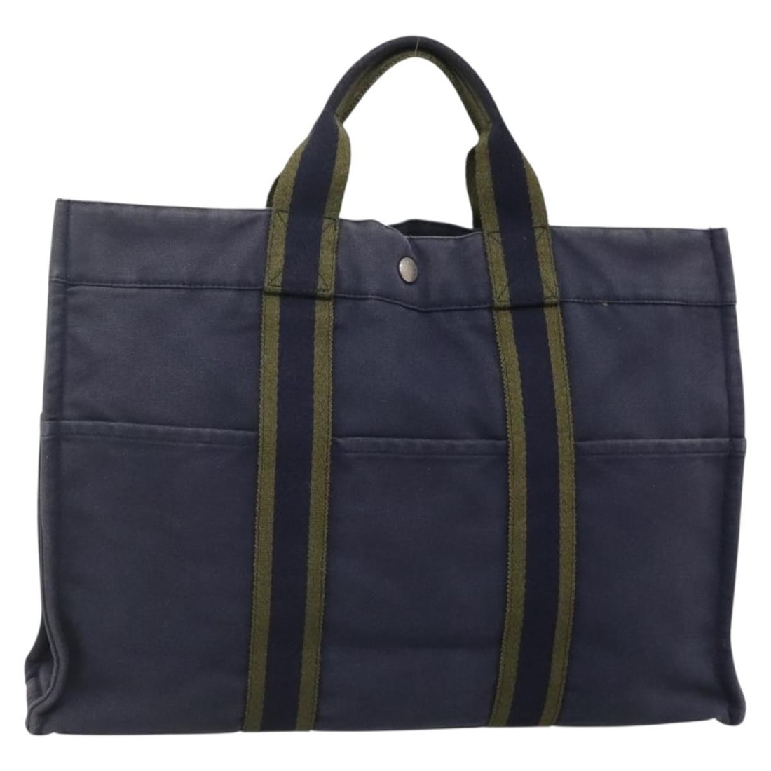 HERMES Fourre Tout MM Navy Canvas Hand Bag Made in France: HERMES Fourre Tout MM Navy Canvas Hand Bag Made in France Introducing the HERMES Fourre Tout MM Hand Bag, a stylish and functional accessory crafted in France. This hand bag features a durable navy ca