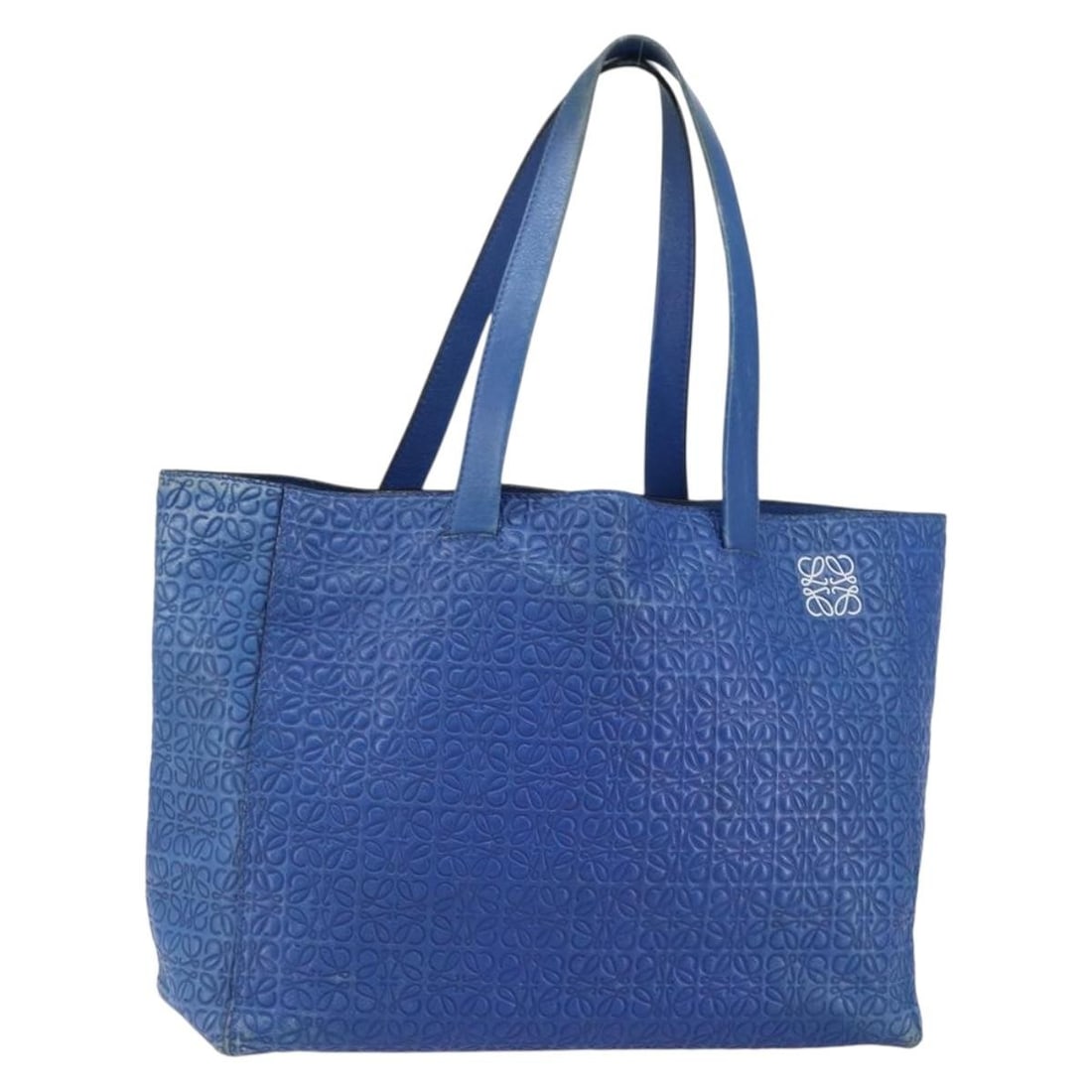 LOEWE Blue Leather Anagram Tote Bag Authentically Made in Spain: LOEWE Blue Leather Anagram Tote Bag Authentically Made in Spain This LOEWE Anagram Tote Bag is a stylish and functional accessory crafted from high-quality leather in a vibrant blue color. Measuring a