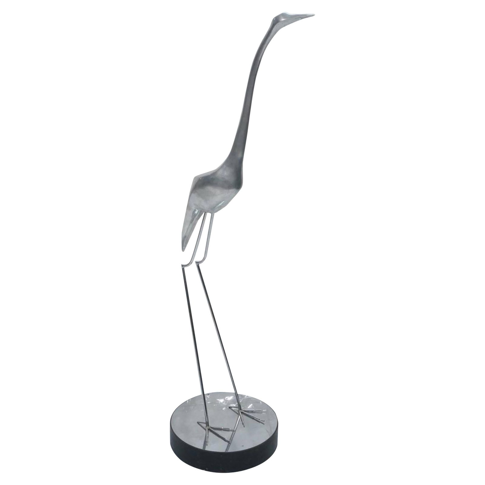 Large Midcentury Egret Sculpture in Chrome by Maison Jansen Style: Large Midcentury Egret Sculpture in Chrome by Maison Jansen Style This striking large midcentury sculpture depicts a standing egret and reflects the elegant style of Maison Jansen. Crafted during the