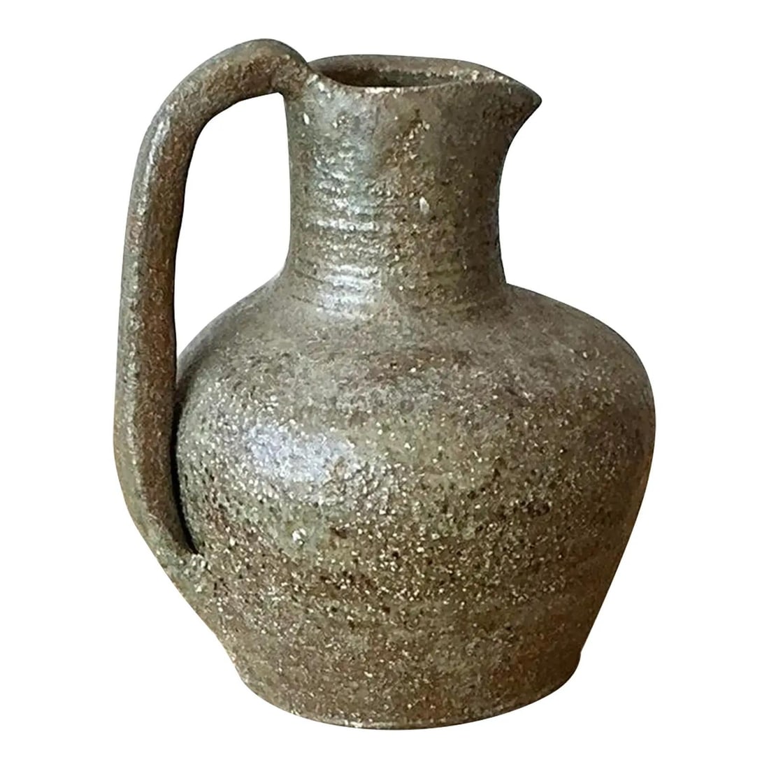 Mid-Century Studio Pottery Pitcher Rustic Boho Design: Mid-Century Studio Pottery Pitcher Rustic Boho Design This vintage Boho pitcher is a stunning example of mid-century Studio Pottery, showcasing the raw and textural qualities of the material. Hand-thr