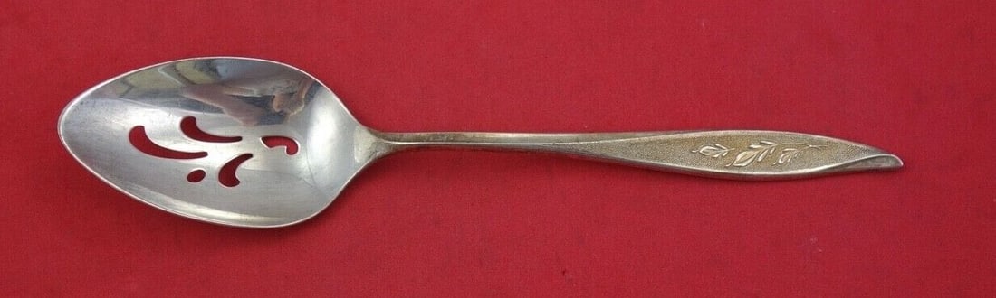 Oneida First Frost Sterling Silver Pierced Serving Spoon 8 1/4": Oneida First Frost Sterling Silver Pierced Serving Spoon 8 1/4" This exquisite serving spoon from Oneida features the intricate First Frost pattern, showcasing a beautiful design that captures the ess