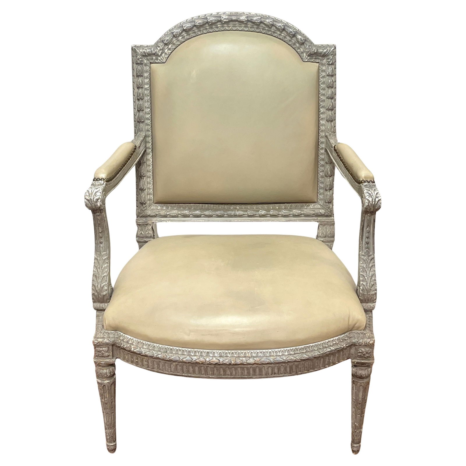 Louis XVI Neoclassical Silvered Leather Bergere Armchair France 20th Century: Louis XVI Neoclassical Silvered Leather Bergere Armchair France 20th Century This exquisite French Louis XVI Neoclassical-style armchair, also known as a bergere, is a stunning piece from the 20th cen