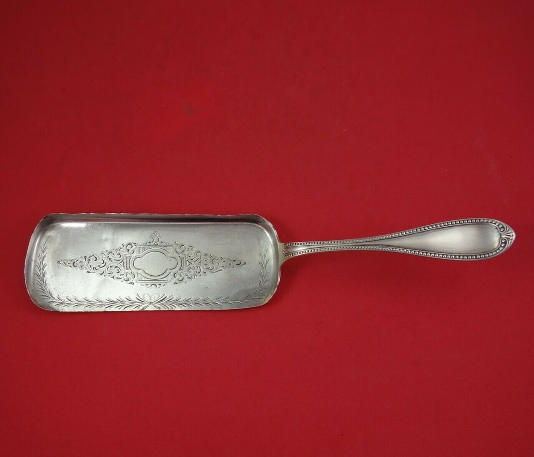 John Polhamus Sterling Silver Crumber 12 Antique Bead Pattern: John Polhamus Sterling Silver Crumber 12 Antique Bead Pattern Discover the exquisite craftsmanship of this antique crumber, made by renowned silversmith John Polhamus. Dating back to 1850-1899, this 1