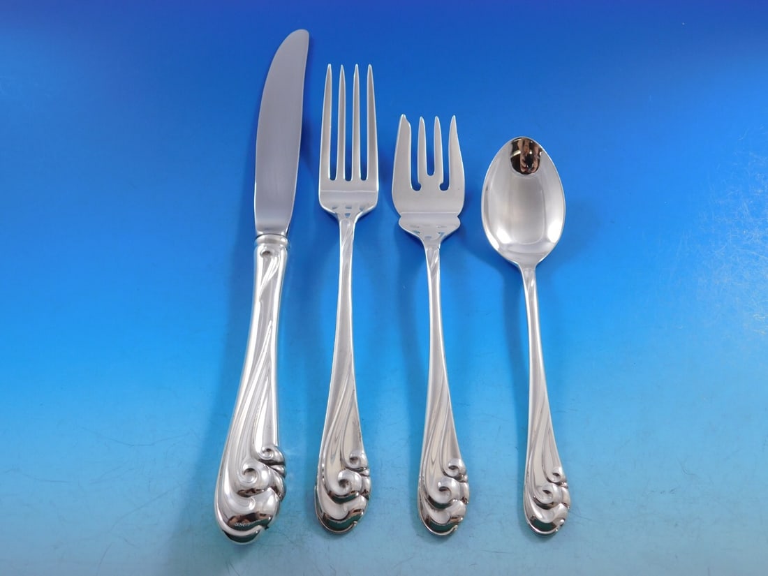 Kirk Dancing Surf Sterling Silver 4-Piece Place Setting: Kirk Dancing Surf Sterling Silver 4-Piece Place Setting Elevate your dining experience with this exquisite 4-piece place setting from the Kirk Dancing Surf pattern, crafted in fine sterling silver. Th
