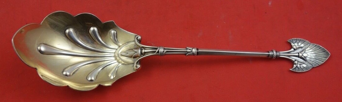 Gorham Lotus Sterling Silver Preserve Spoon Gold Wash 7.75": Gorham Lotus Sterling Silver Preserve Spoon Gold Wash 7.75" Enhance your dining experience with this exquisite Lotus by Gorham preserve spoon. Crafted from high-quality sterling silver, this spoon fea