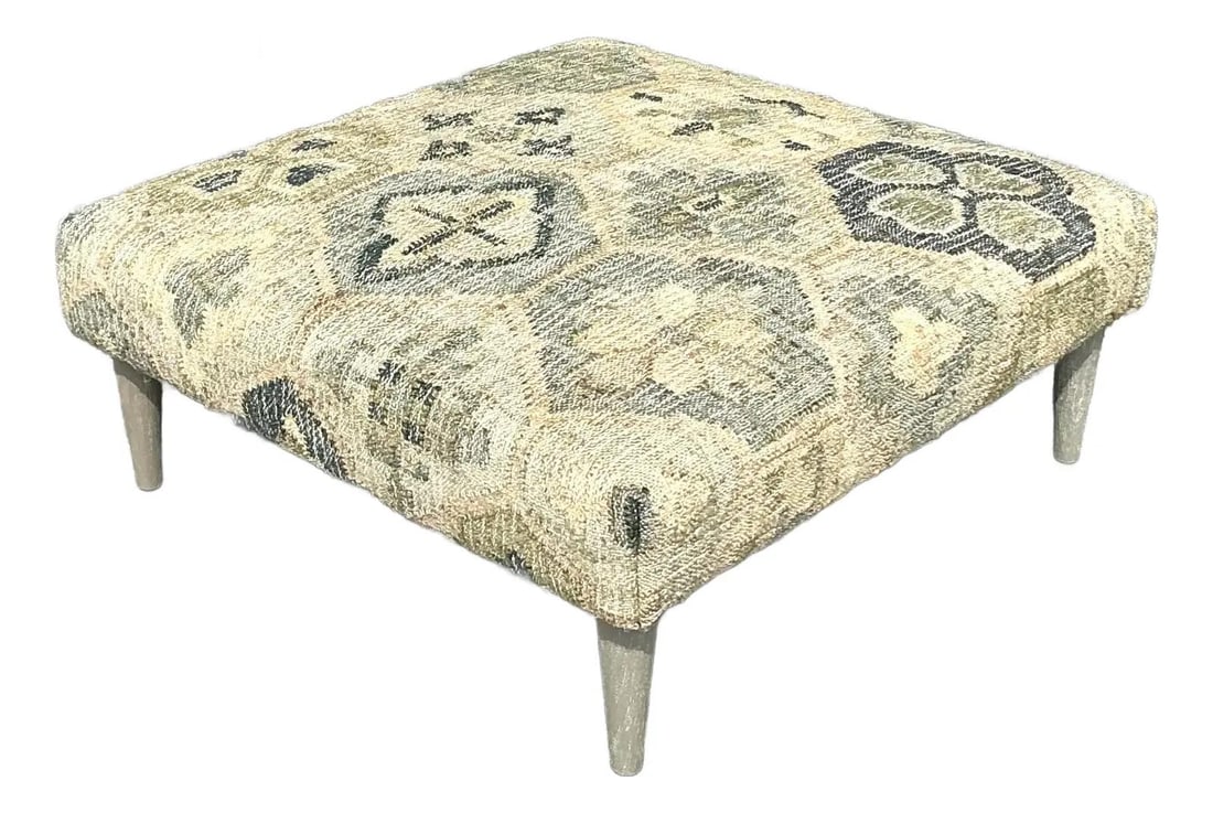 Vintage Boho Kilim Ottoman with Mid-Century Legs 41.5" W: Vintage Boho Kilim Ottoman with Mid-Century Legs 41.5" W Enhance your living space with this captivating Vintage Boho Woven Kilim Style Ottoman. Upholstered in a beautifully woven Kilim-style fabric,