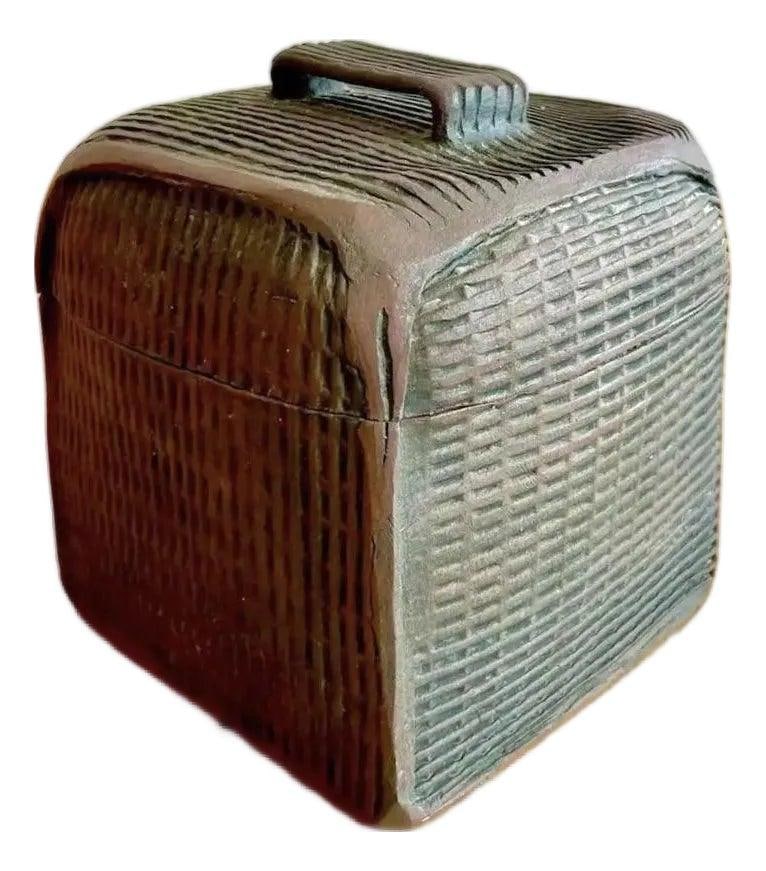 Vintage Boho Pottery Lidded Box with Textured Surface: Vintage Boho Pottery Lidded Box with Textured Surface This vintage Boho studio pottery lidded box features a textured ceramic design with a dark, earthy ebony finish. The cube-like form is adorned wit