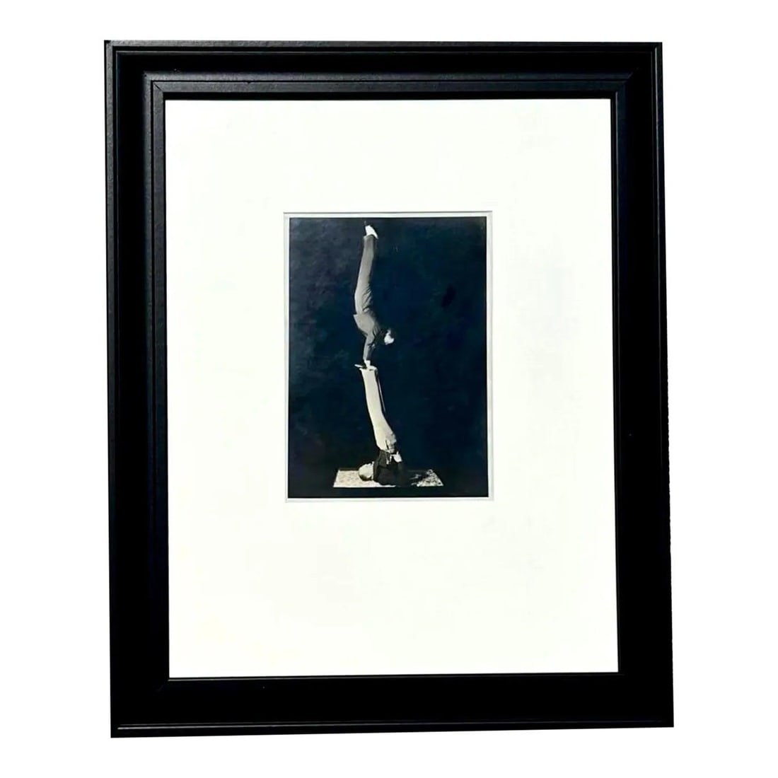 Black and White Framed Acrobats Photograph in Bohemian Vintage Style: Black and White Framed Acrobats Photograph in Bohemian Vintage Style This vintage black and white photograph captures acrobats in a striking moment of balance and artistry. The image is presented in a