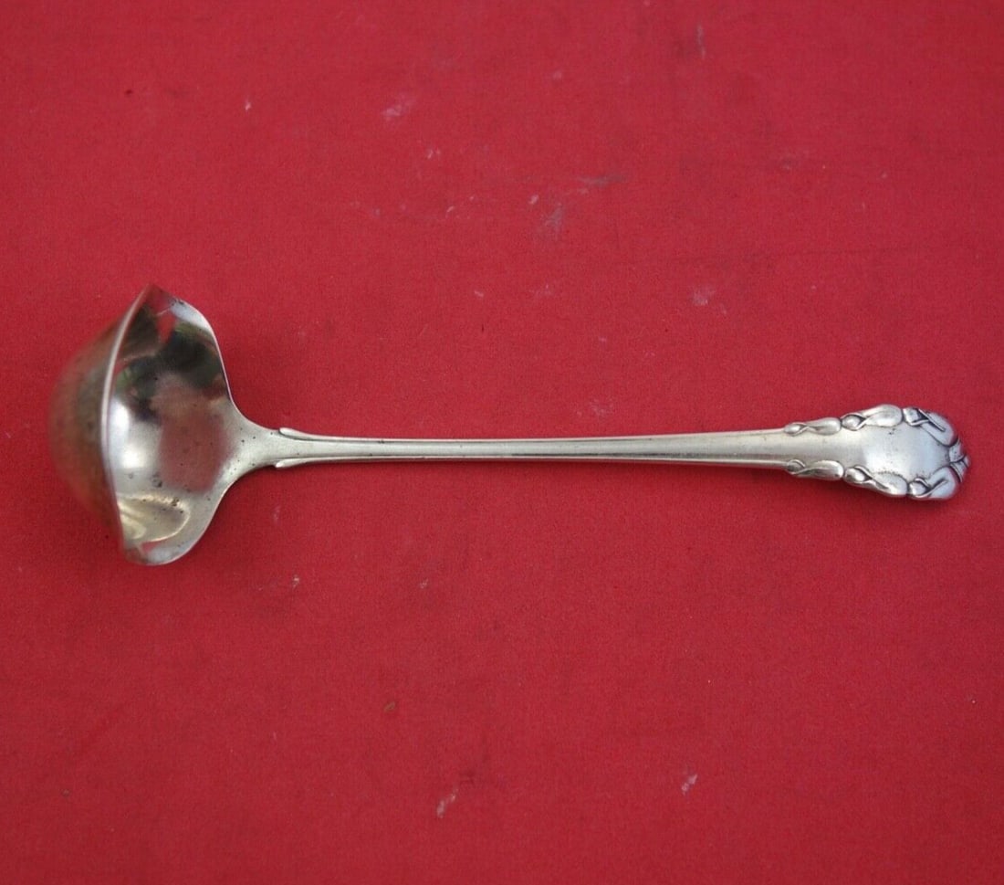 Georg Jensen Sterling Silver 5 Inch Sauce Ladle Lily of the Valley Pattern: Georg Jensen Sterling Silver 5 Inch Sauce Ladle Lily of the Valley Pattern This exquisite sauce ladle from Georg Jensen features the elegant "Lily of the Valley" pattern. Crafted from high-quality ste