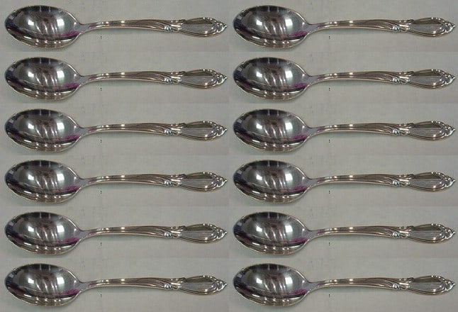 Set of 12 Rhapsody New International Sterling Silver Soup Spoons: Set of 12 Rhapsody New International Sterling Silver Soup Spoons Elevate your dining experience with this exquisite set of 12 Rhapsody New by International Sterling Silver Place Soup Spoons. Each spoo
