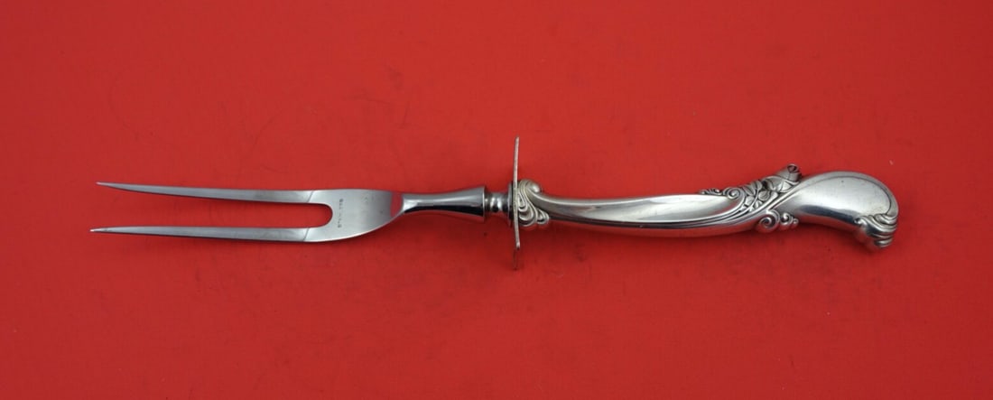 Wallace Waltz of Spring Sterling Silver Carving Fork 11 Inch: Wallace Waltz of Spring Sterling Silver Carving Fork 11 Inch Elevate your dining experience with the exquisite Waltz of Spring roast carving fork by Wallace. This elegant serving fork, crafted from hi