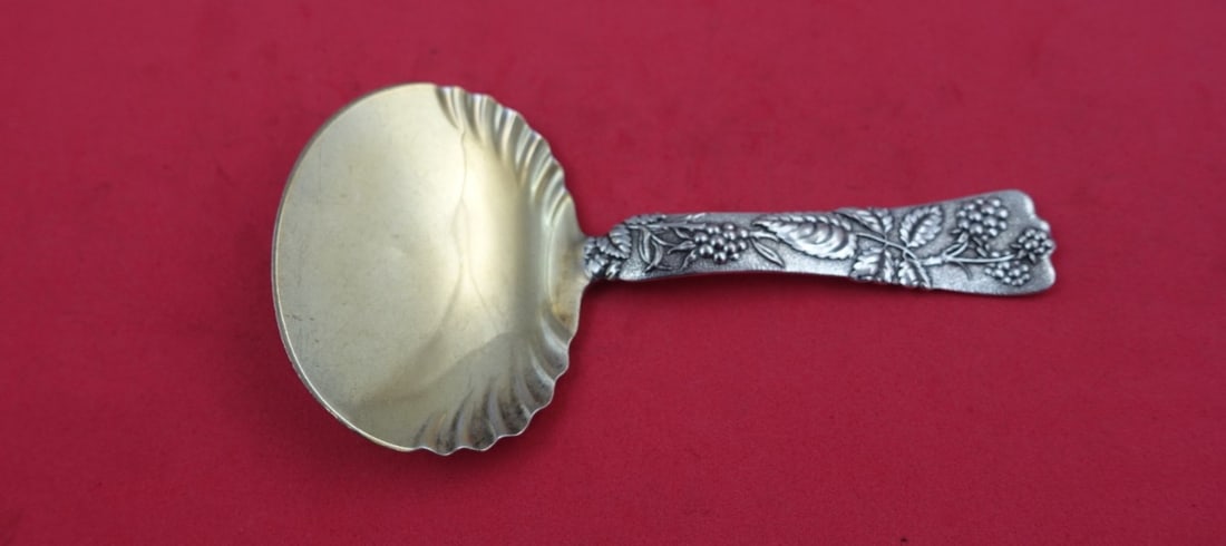 Tiffany & Co Vine Sterling Silver Bon Bon Spoon Gold Washed Raspberry 5.25": Tiffany & Co Vine Sterling Silver Bon Bon Spoon Gold Washed Raspberry 5.25" This exquisite Vine by Tiffany & Co. serving spoon showcases the elegance of the Vine pattern. Crafted from high-quality ste