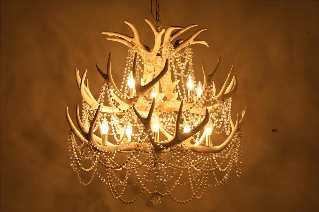 Terracotta Denali Two-Tier Chandelier with Faux Antler and Crystals: Terracotta Denali Two-Tier Chandelier with Faux Antler and Crystals Introducing the Denali Chandelier, a perfect blend of rustic sophistication and elegant design. This stunning two-tier crystal chand